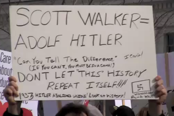 Typical hate-filled sign held by Lefty Union members and Wisconsin Teachers as they marched and screamed with fury that their entitlements from the public teat were being threatened