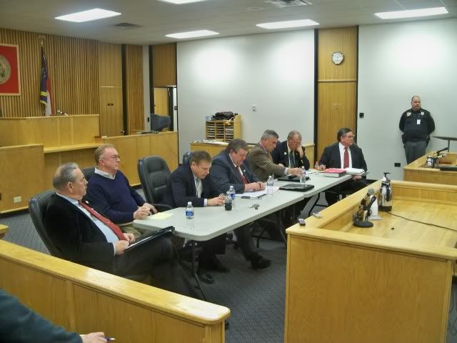 The Macon County Commissioners were seated at the front of the courtroom for the meeting 
Photo by Bobby Coggins