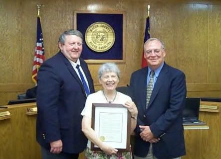 Ronnie Beale (L), Barbara McRae (C), and Bobby Kuppers (R). Barbara McRae was made an Honorary historian of Macon County at the August 9, 2010 Macon County Commissioners meeting.