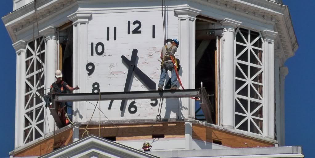 Workers fasten cable to the cupola atop the old Jackson County Courthouse in Sylva, NC on July 1, 2010. Photo by Bobby Coggins.