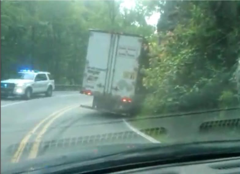 screencap from video showing the usual result of tractor trailer use of the Highlands Road between franklin and Highlands in North Carolina