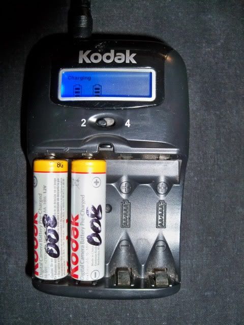 A pair of my trust-worthy Kodak AA batteries recharging. Photo by Bobby Coggins