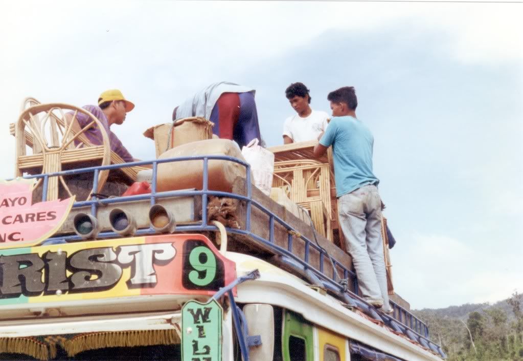 Armando helping load Jeepney roof
