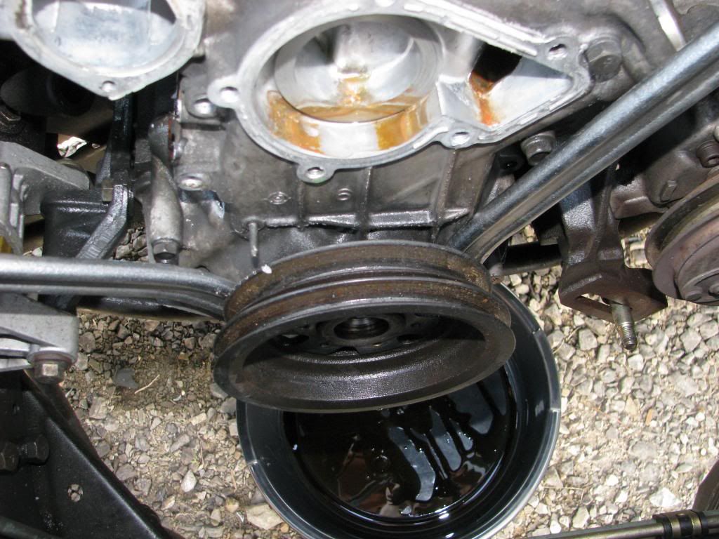 You should actually screw the crankshaft pulley bolt back in a few threads just so it will catch the pulley when it comes off the end of the crank.
